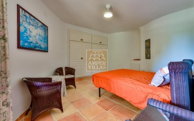 A beautiful villa in a peaceful, green setting.