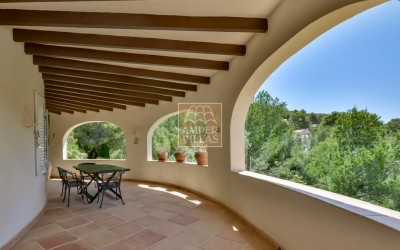 A beautiful villa in a peaceful, green setting.