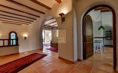 A beautiful villa in a peaceful, green setting.