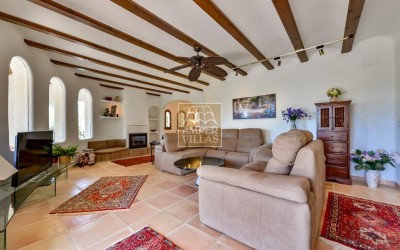 A beautiful villa in a peaceful, green setting.