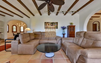 A beautiful villa in a peaceful, green setting.